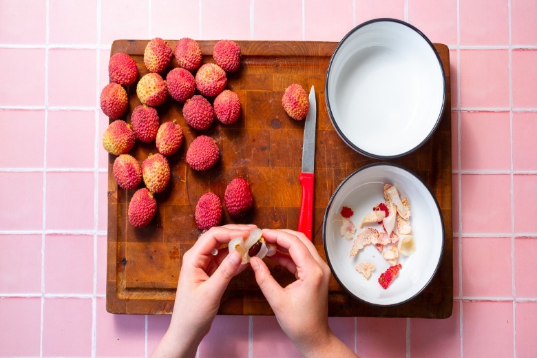 Removing the pit from lychee
