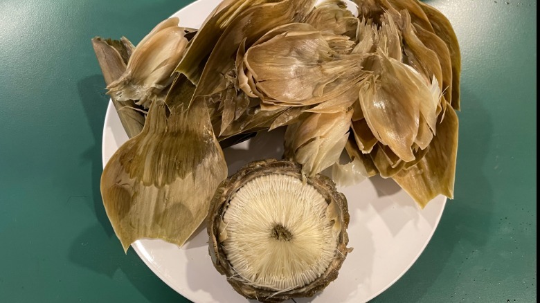 Peeled artichoke with choke still on heart