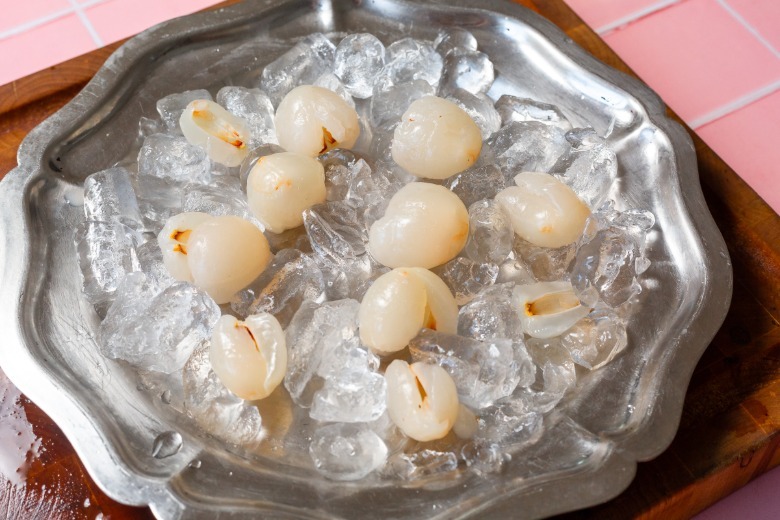 Lychee on a metal serving platter with ice