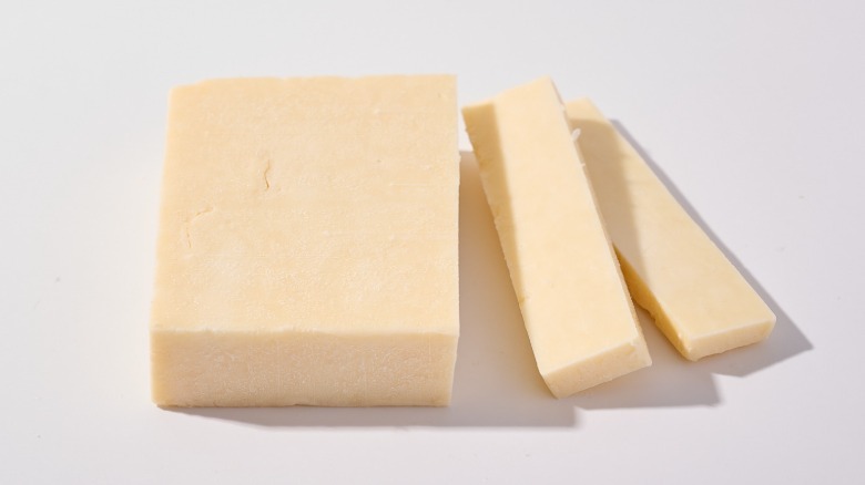 Sliced cheddar cheese on a table