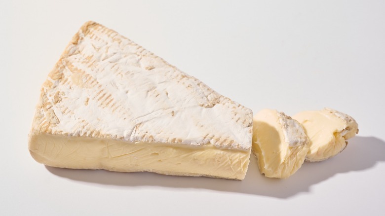 brie cheese sliced on a table