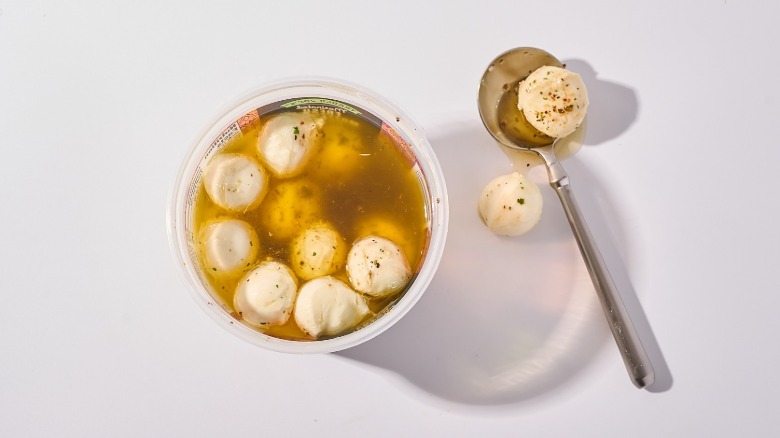 balls of mozzarella on spoon