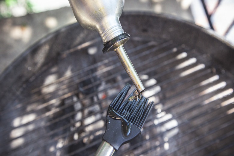 Pouring oil onto silicone brush