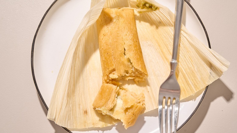 Tamale unwrapped on a plate