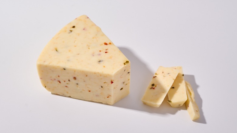 Monterey Jack Cheese sliced on table