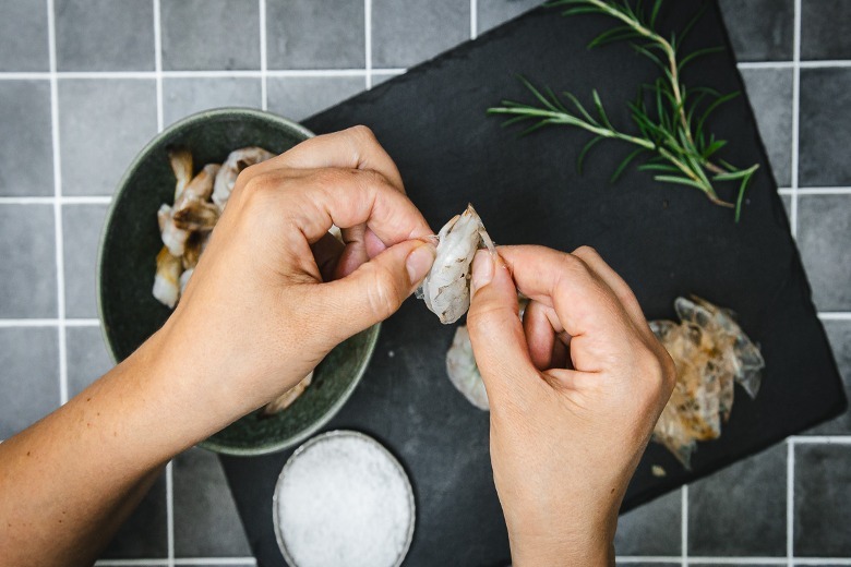 Removing shells from shrimp