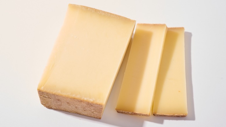 sliced compté cheese on a table