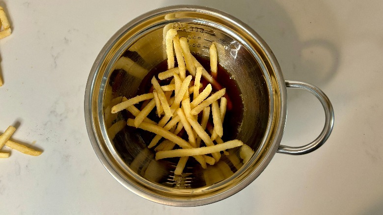 Fries in bowl of broth