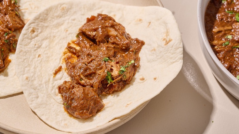 chicken mole inside a tortilla