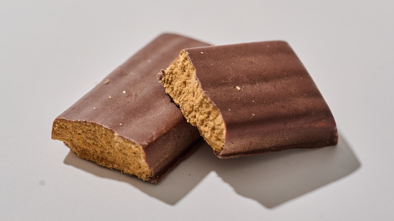 Protein bar split in half on a table