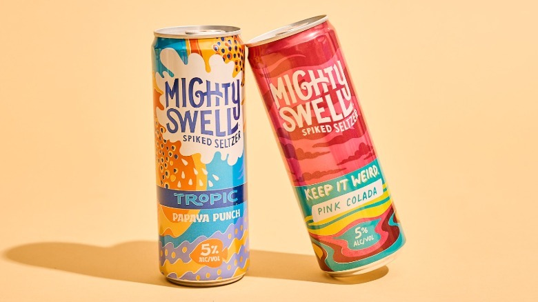 two mighty swell cans on a table