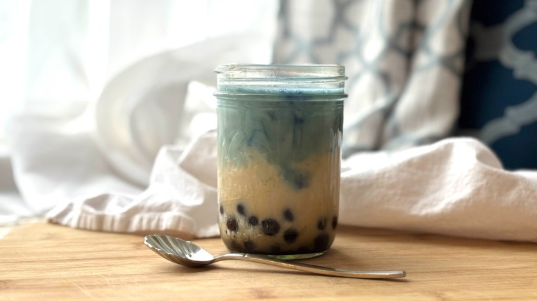 glass of butterfly pea powder bubble tea