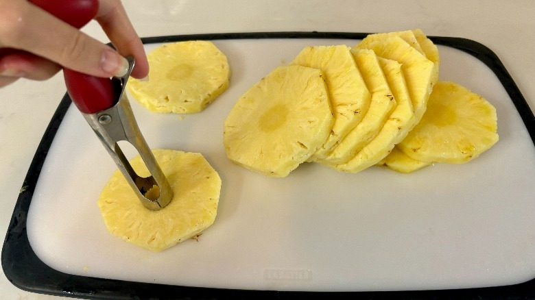 Pineapple being cored