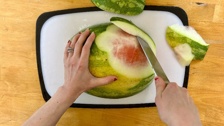 Watermelon being peeled