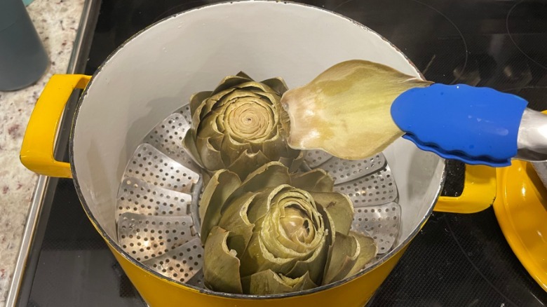Steamed artichokes doneness check