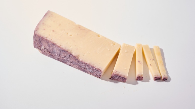 Sliced Toscano cheese on a table