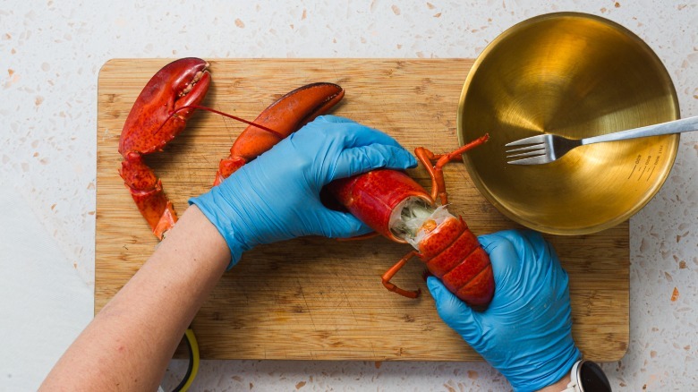 Pulling tail from lobster