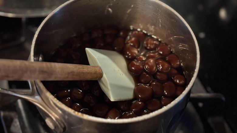 stirring boba pearls in syrup