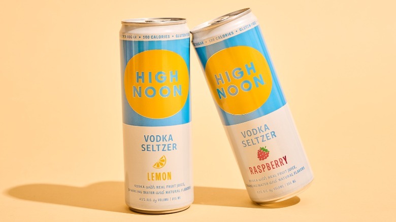 two high noon cans on a table