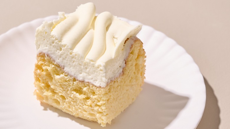 slice of tres leches cake on a plate