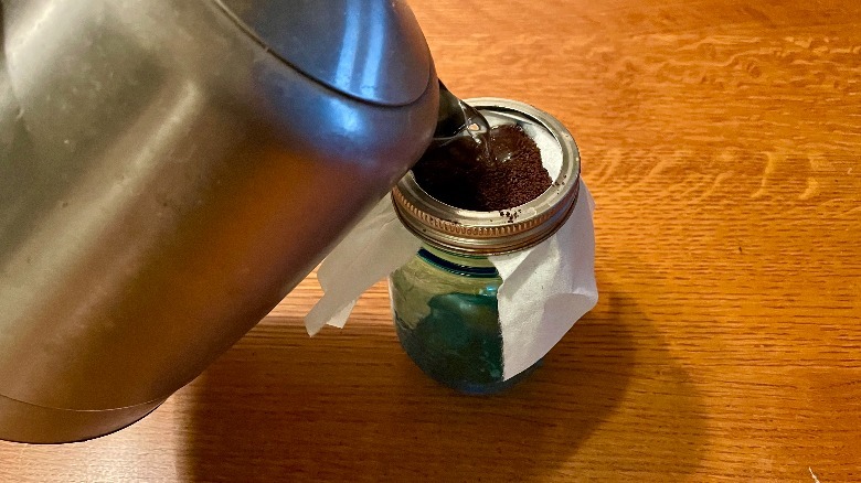 Hot water poured over coffee grounds