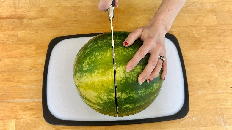 Knife cutting watermelon
