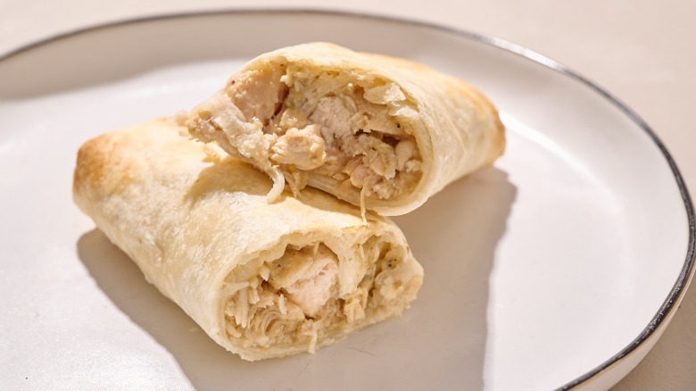 chicken chile verde burrito on a plate