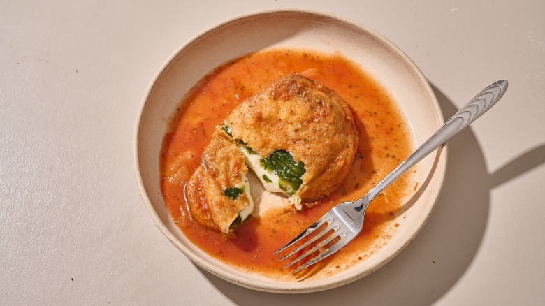 chiles rellenos with a fork on a plate